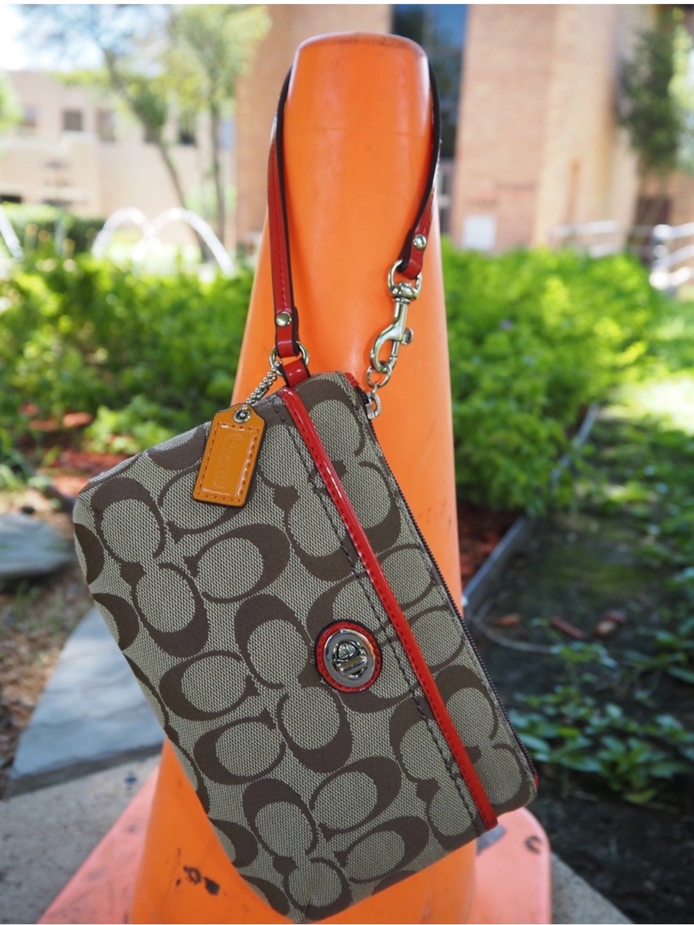 Coach Brown Signature Canvas Wristlet with Red Trim and Orange Tag

EUC